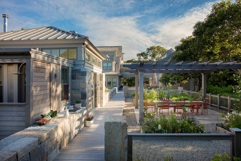 Outdoor vegetable garden terrace at Cape Cod custom home by Hutker Architects