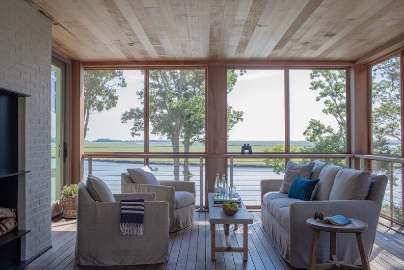 screen porch lounge overlooking duxbury salt marsh by hutker architects
